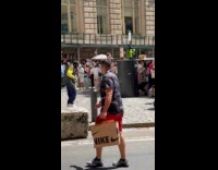 Man yellow shirt dance to music street