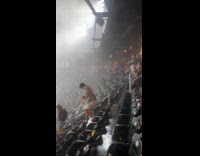 Collab WINY - People evacuate from stadium during heavy rain
