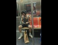 Man plays air drums next to another person