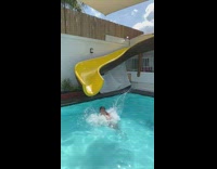 Woman bumps head down water slide