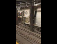 Derailed subway train ripped side black pole