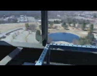 Guy sit above high speed elevator shaft