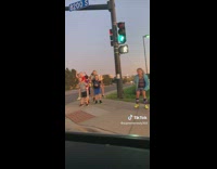 Group of little kids at corner guy yells santa isnt real