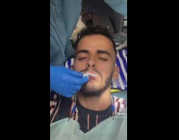 Dentist asks guy questions while mouth is closed 