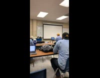 Guy trying to run and slips in classroom