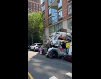 Parked car covered with lots of stuff part 1