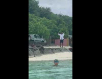 pt 1 man in open white button down beach selfies