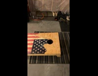 Skateboard cornhole trick shot success