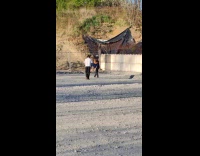 Man brown hat tiktok dance on field