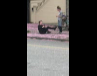 Man in Black Lays On Ground for Aesthetic Selfie 
