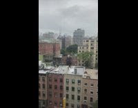 Man play golf on building rooftop overcast