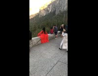 Girl long red sleeves dress sit mountain