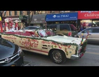 Santa Claus drives in white convertible Christmas car with music and Rudolph