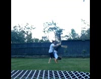 girl doing flip with friend faceplants