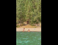Woman with furry top bikini poses at the beach