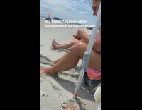 Girl throws chips behind couple at beach to move them