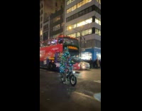 Christmas tree with lights ride bike street night