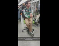 Guy sits on own chair subway train 