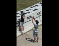 Man poses with his VIP ID on the back