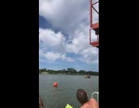 Red bathing suit girl flips belly flops 