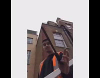 Guy gets tool thrown at his nose by friend standing on stairs, nose starts bleeding