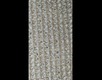 Ant crawls through grey rug fibers 