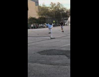 Person in alice in wonderland costume bends over 