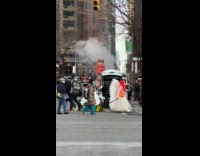 Angel pulls tombstone trolley cross the street