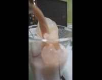 Ice slowly melts when the chocolate milk is poured