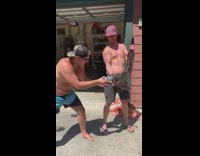Shotgunning a beer opened from a giant caught fish
