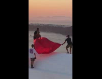 Red dress girl guy pose white rooftop 