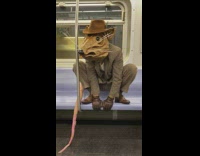 Rat costume guy poses for photo subway 