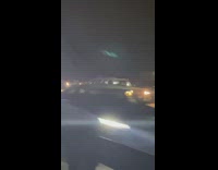 Car backs up on freeway missed exit 