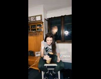 Girl electric massage shakes cup of water