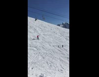 Skier glues skis together, backflips off a ramp, and lands in the snow