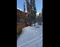 Man backflips off wooden porch fence after taking a swig of beer and lands in the snow on his butt 