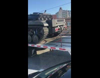 Black military cars on flatbed