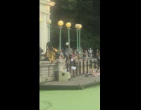 Guy unbuttoned shirt white ball head bicycle