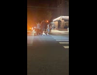 Guys transport statue pulls trolley on street