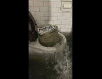 Toilet with cement bags has flood waters