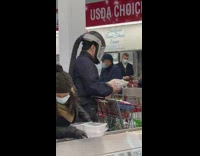 Couple at costco wear air filtering helmets 