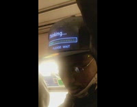 man with black hat thinking please wait