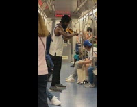 Guy plays violin in middle of subway 