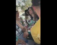 Owner and dog have matching shirts at bar 