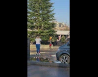 Woman deer mask jacket dance near tree