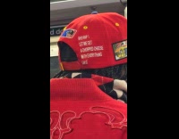 Man wears chopped cheese cap in subway