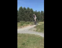 Guy jumps dirt hill squeaky bicycle fail