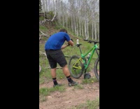 Biker takes photo of beverage on bike seat 