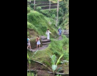 Woman white dress poses on walk trail