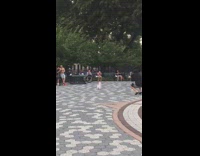 Pink shirt orange pants guy skateboards park 